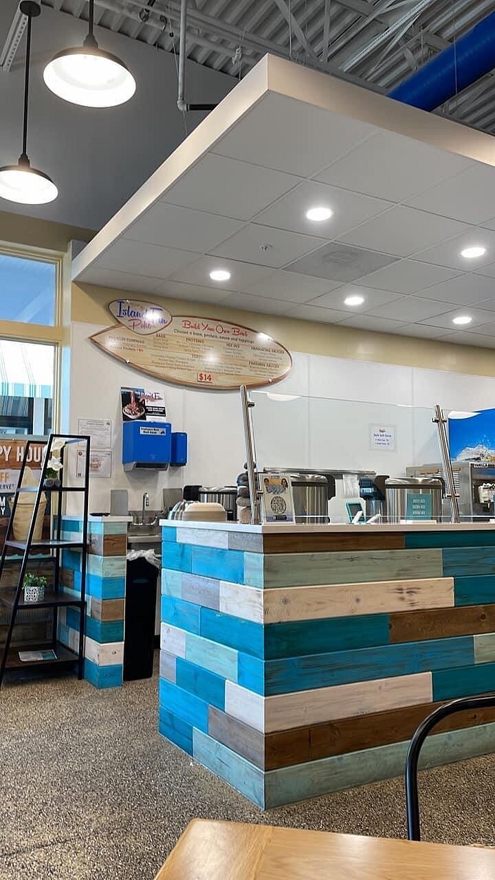 Bright interior seating at Island Fin Poké Co. Beachwalk