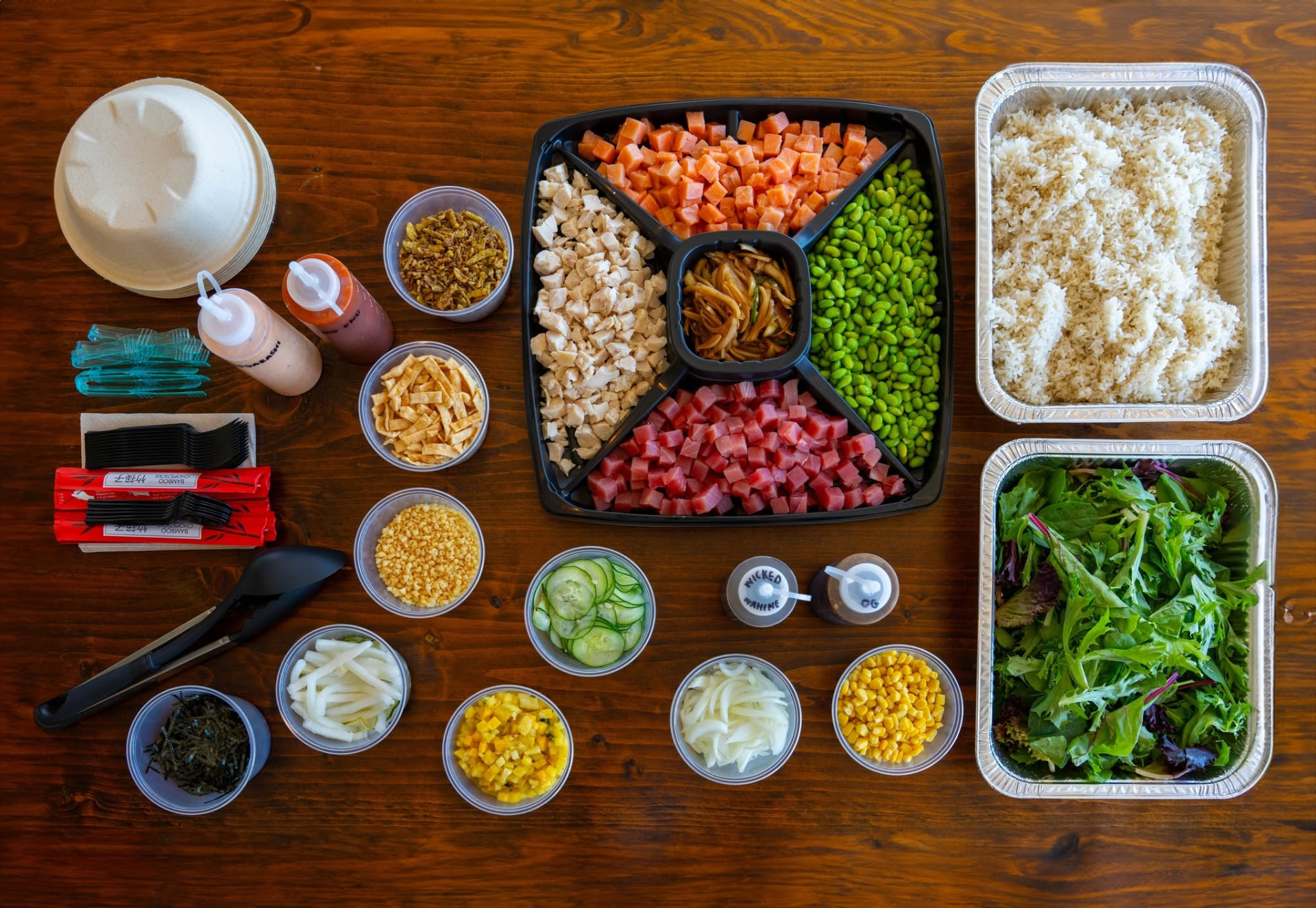 Colorful fresh toppings and proteins on the Beachwalk poké line