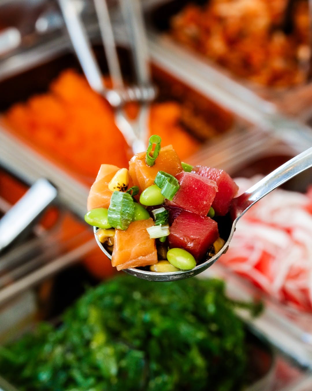 Fresh salmon and tuna poké scooped at Island Fin Poké Co. Beachwalk